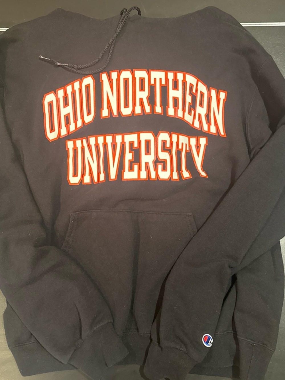 Champion Black Hoodie with Orange & White Ohio Northern University Logo